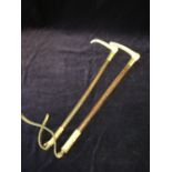 A pair of bone handles riding crops by Parker & Sons London