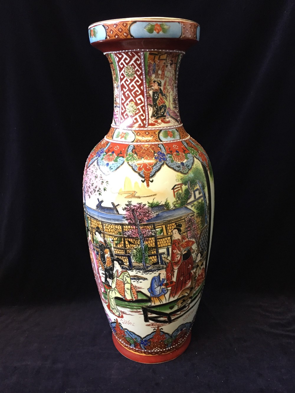 A tall Japanese vase