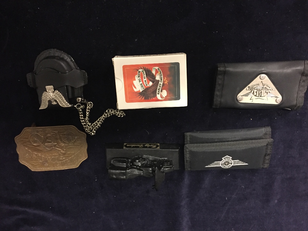 Selection of Harley Davidson Collectors items to include a deck of cards, two key cases, a belt