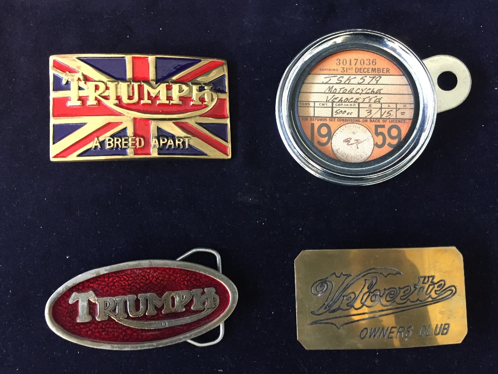 Three motorcycle themed belt buckles and a tax disk holder with a 1959 dated Velocette tax disc