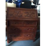 Oriental bureau with two over two drawer arrangement.