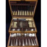 A six place canteen of cutlery in original box with key