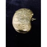 A silver vesta case