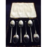 A boxed set of silver teaspoons