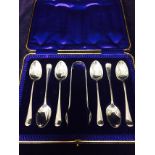Hallmarked boxed set of silver spoons and sugar nips by John Round Sheffield 1907