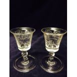 A pair of George II wine glasses with engraved grape vine C1740