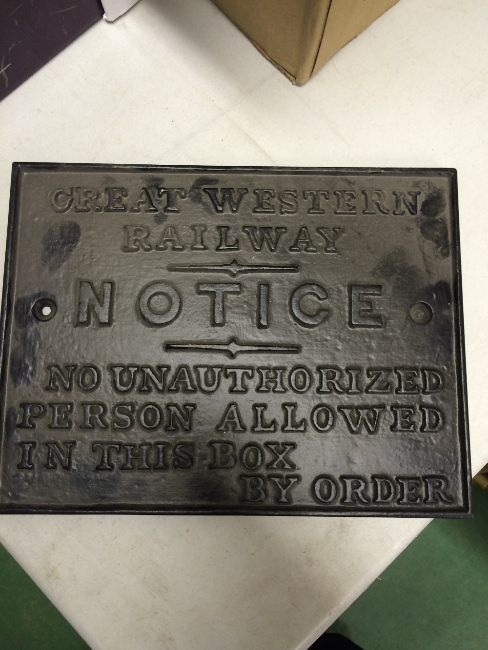 A cast iron Great Western Railway sign