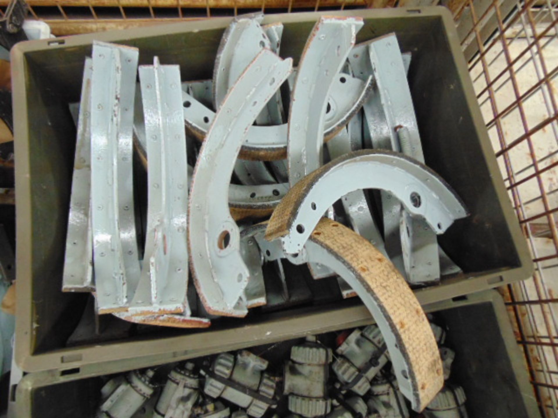 Stillage of Ex Reserve New Old Stock DUKW Parts inc: Brake Shoes, Wheel Cylinders, Hubs etc - Image 2 of 6