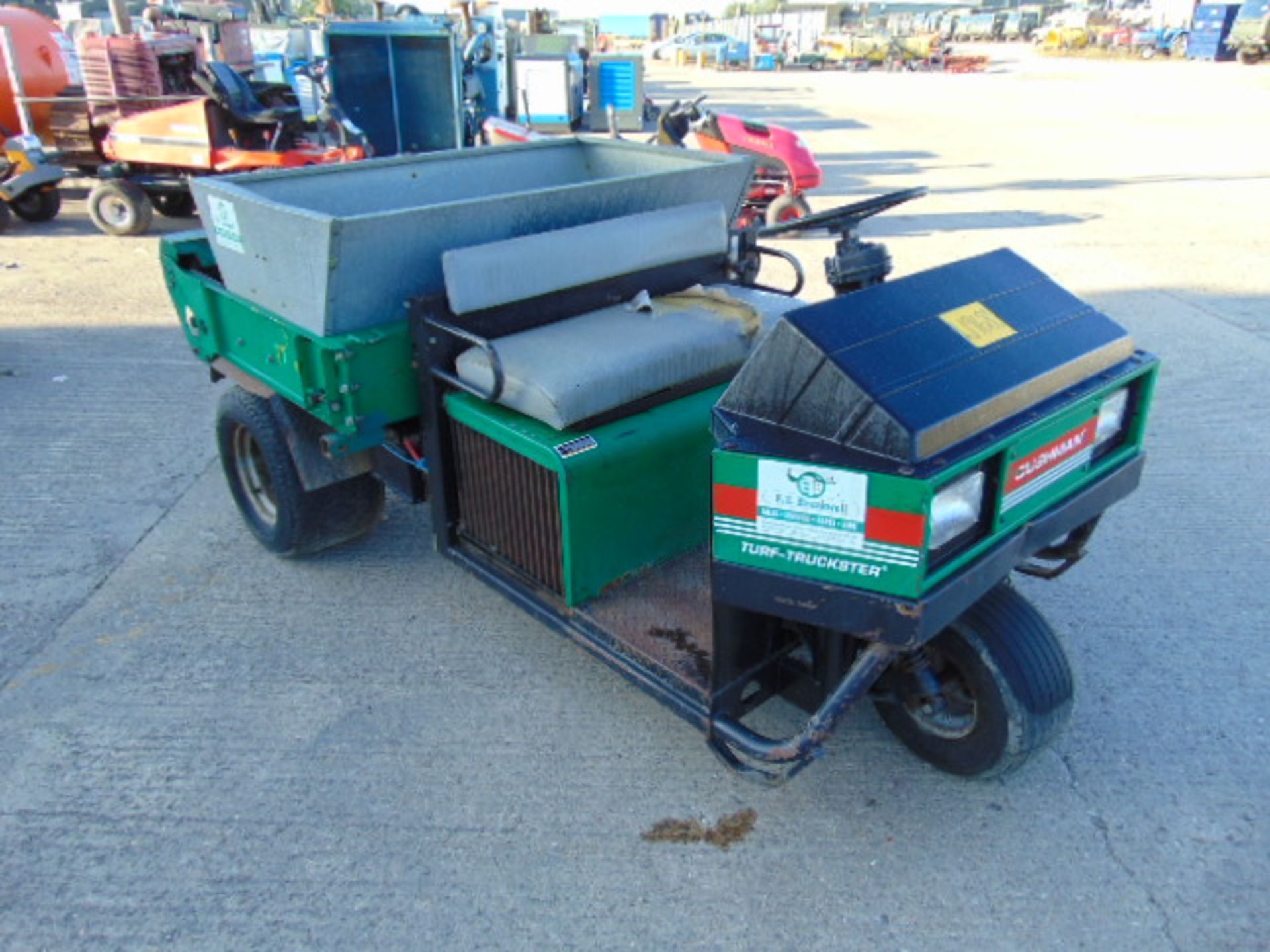 Cushman Turf-Truckster with a Cushman TD1500 Top Dresser/seeder