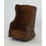 An early 20th Century carved wooden apprentice rocking chair
The carved wooden sides, seat and back