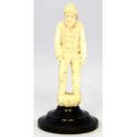 A Continental ivory carving of a fisherman, possibly French or German
The figure modelled as a