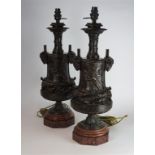 A pair of bronze ewers/lamps, 19th Century
The vase surmounted by spiralling turned necks, flanked