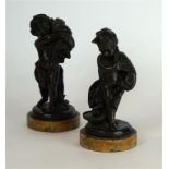 A pair of 19th Century European bronze figures
Each in the form of an emblematic putti, one