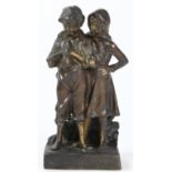 A 20th Century cold painted and patinated bronze figure of a boy and a girl
Cast modelled on a