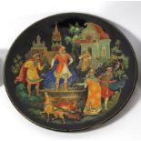 A finely painted Russian papier-mâché dish, signed B. Bakahob
Of circular form, the gilt dot border