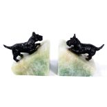 A pair of Art Deco figural dog bookends
Each of simulated green onyx triangular form adorned with a