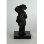 A 19th Century European bronze figure
Modelled as a semi naked emblematic putti, carrying a sheath