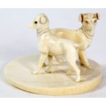 A late 19th/early 20th Century carved ivory dog figure group, possibly German
Carved mounted on a