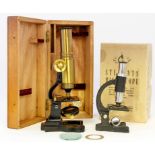 An early 20th Century brass bound and black painted compound microscope
The black painted stand and