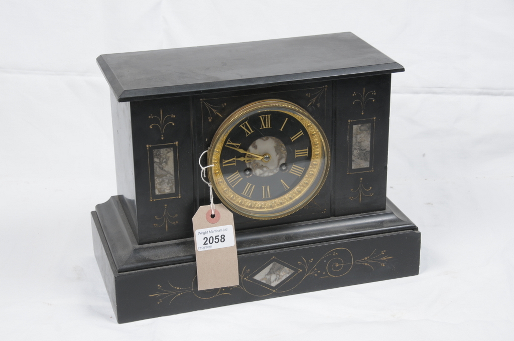 A Victorian slate noir mantel clock
With a 10cm dial with Roman numerals the two train with outside