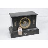 A Victorian slate noir mantel clock
With a 10cm dial with Roman numerals the two train with outside