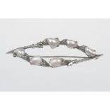 An early 20th Century Arts & Craft style freshwater pearl brooch
Set with six Baroque freshwater