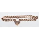 A 9ct rose gold flat curve link bracelet
With paddock clasp, 17.4 grams.