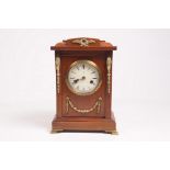 A stained walnut and brass embellished mantel clock
With a 10cm convex dial the two train Hamburg
