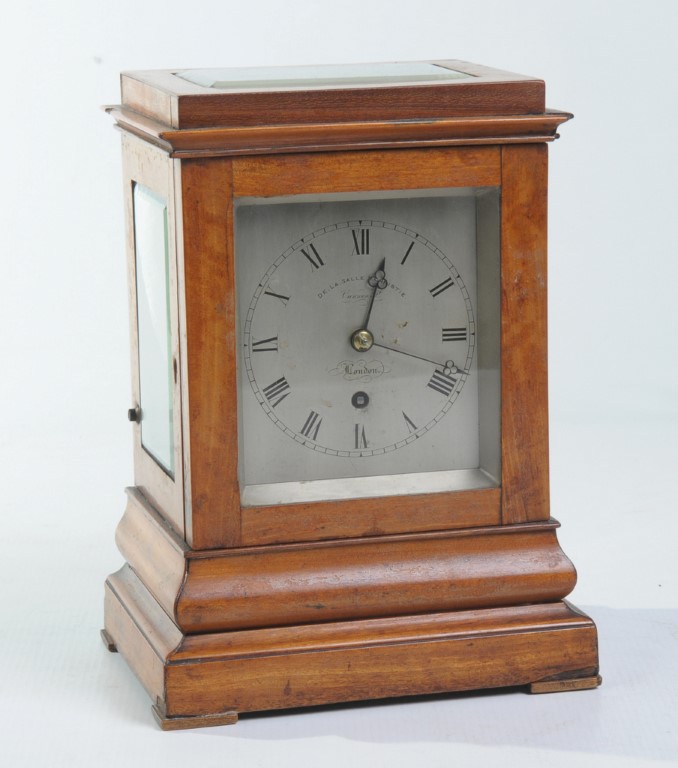 An early 19th Century satinwood mantel timepiece
With a 9cm silvered dial signed De.La.Salle and