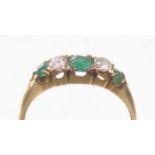 An early 20th Century emerald and diamond five stone ring
The three cushion cut emeralds