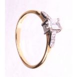 An emerald cut diamond solitaire ring
The emerald cut diamond of an estimated 0.33cts, four claw