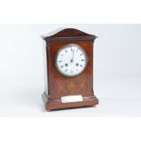 An Edwardian inlaid mahogany mantel clock
With a 11cm convex white dial, lacking seconds hand the