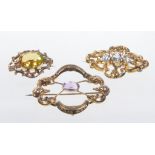 A late 19th Century amethyst set openwork brooch
The central oval mixed cut amethyst within an