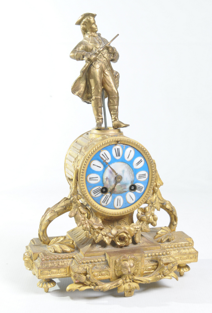 A 19th Century French gilt spelter and porcelain figural mantel clock
With a 8cm porcelain dial