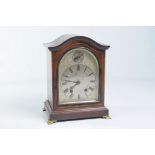 An Edwardian inlaid mahogany bracket clock
With a 14cm silvered dial, Roman numerals with a slow