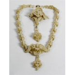 A late 19th/early 20th century seed pearl work necklace and brooch set
The necklace with central