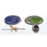 A silver and silver gilt bar brooch with central dog motif
Together with two further agate silver