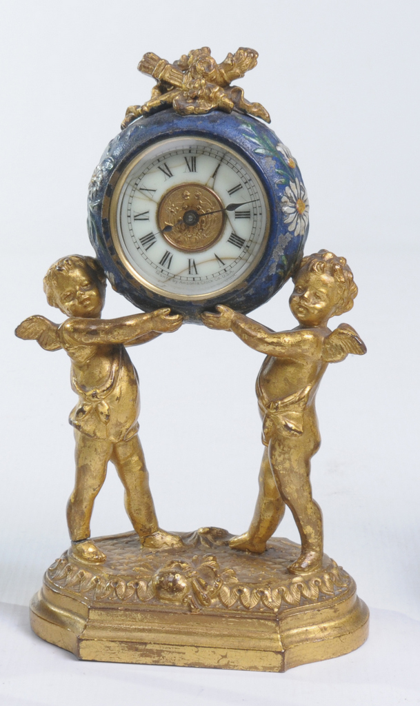 A French gilt metal timepiece
With a 5cm white dial, hairline cracks, spring movement the drum case