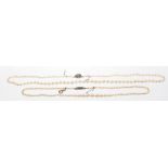 Two graduated cultured pearl necklaces
Each to white metal clasp with safety chains (2).