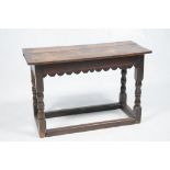 An 18th Century and later oak side table
The rectangular two plank top above a shaped frieze raised