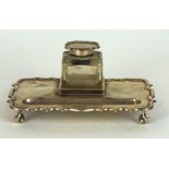 A George V hallmarked silver rectangular desk stand
Having detachable glass inkwell with hallmarked