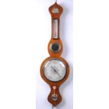 A Rosewood veneered wheel barometer 19th Century
With a 19cm register, level mirror,