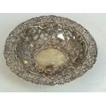 A late Victorian hallmarked silver circular sweet meat bowl
Having a cast and pierced rim depicting