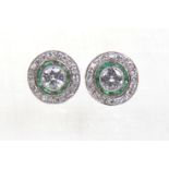 A pair of Art Deco style diamond set ear studs
Set with a central round brilliant cut diamond to a