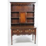 An early 19th Century oak and mahogany crossbanded high back dresser
With a cavetto cornice above a