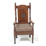 An early 20th Century oak Eisteddfod armchair,