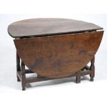 An 18th Century oval oak gateleg dining table
The oval top with two hinged flaps raised upon four