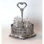 A Victorian silver-plated sauce bottle stand
Having four cut glass bottles and covers,