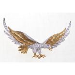 A fine quality diamond set brooch
In the form of a bird of prey with wings outstretched,