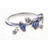 Cartier: a sapphire and diamond set platinum ring
The pear,